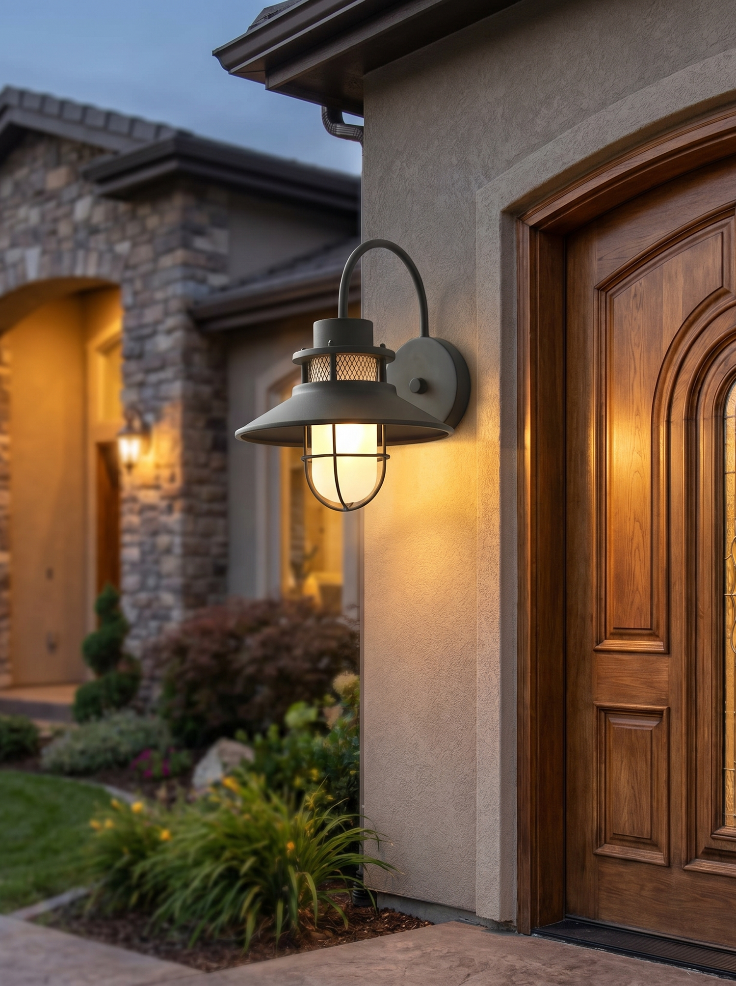Outdoor wall lantern beside entrance at dusk, lifestyle