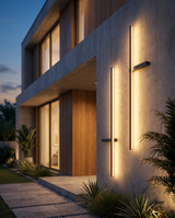 Outdoor pillar wall light on exterior wall at dusk, lifestyle