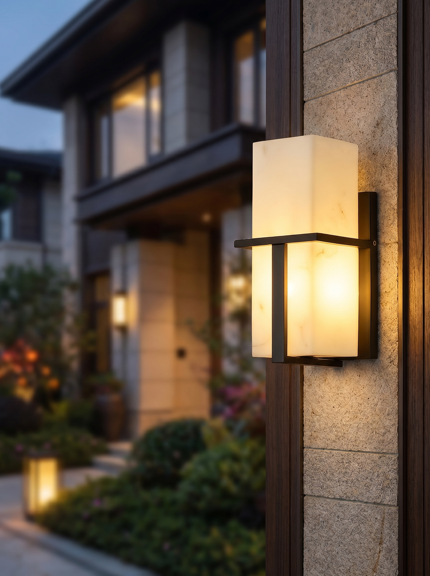 Sophisticated outdoor LED wall sconce at dusk, lifestyle