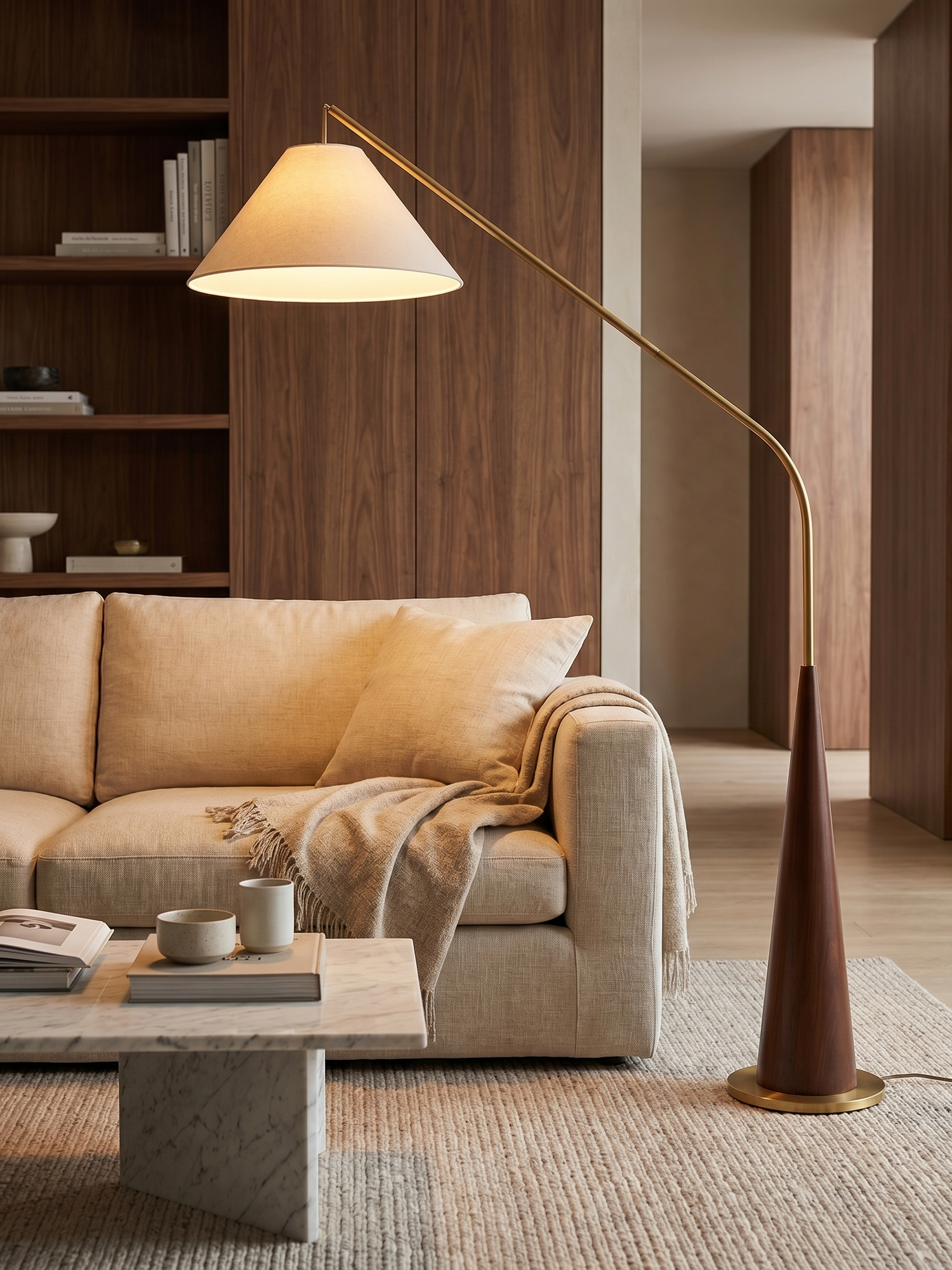Arc floor lamp with wooden base over sofa, lifestyle