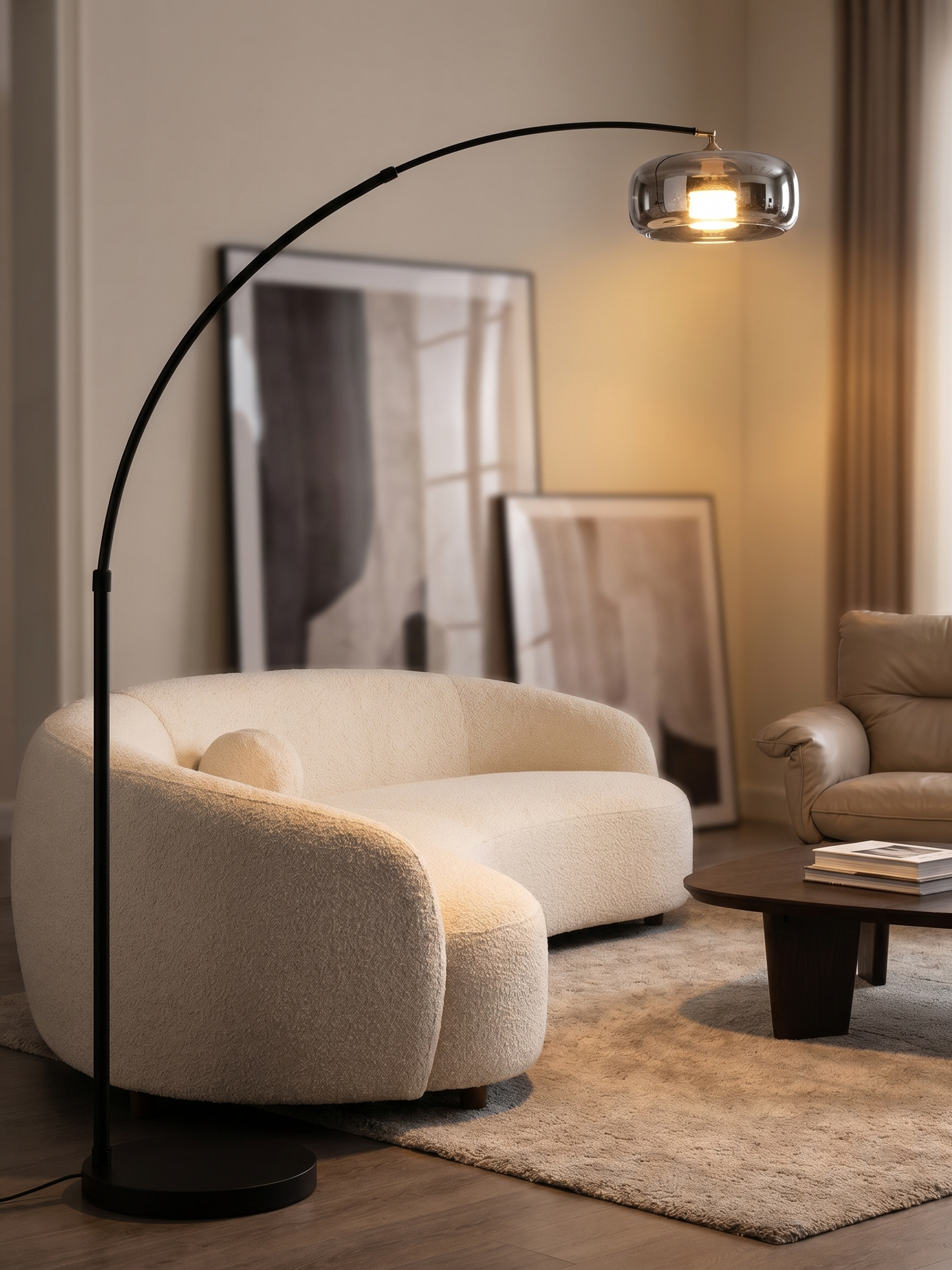 Black arc floor lamp with glass shade over sofa, lifestyle
