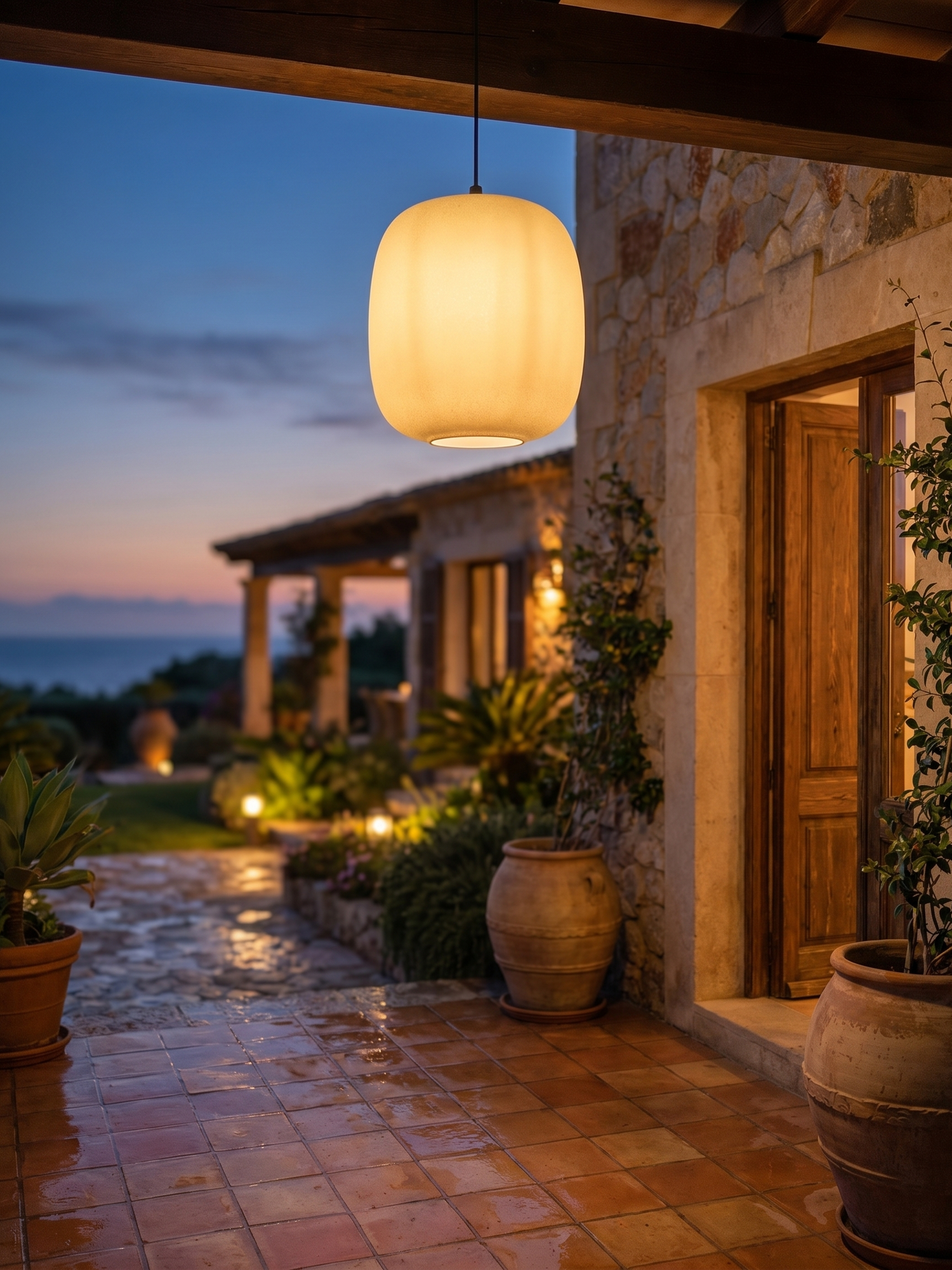 Waterproof outdoor hanging pendant over patio, lifestyle