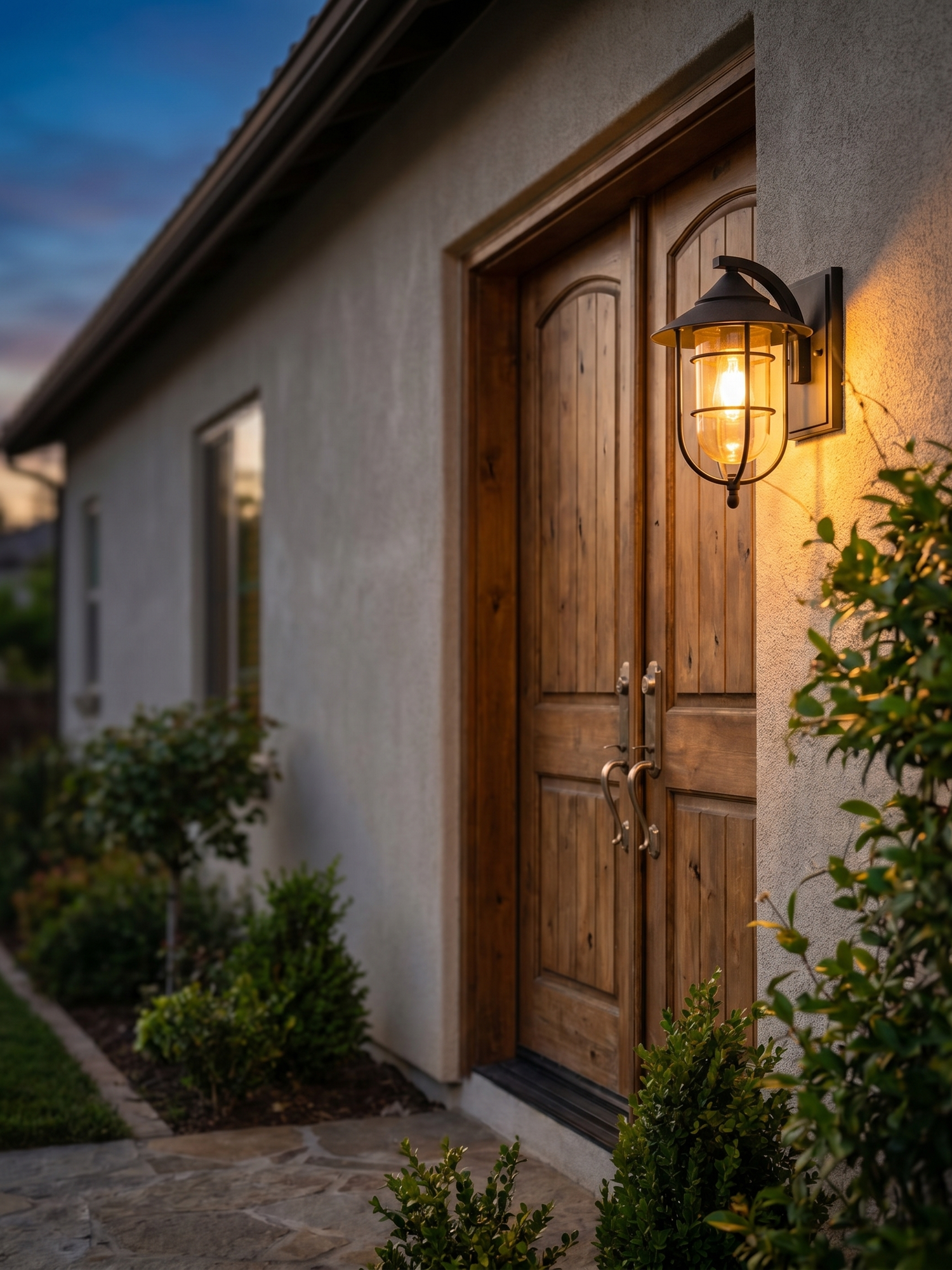 Birdcage outdoor porch wall light beside entrance, lifestyle