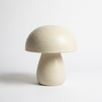 Cream ceramic mushroom lamp on white studio background