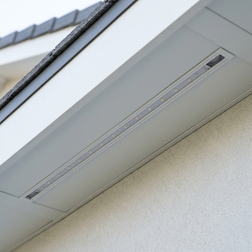 Discreet permanent eave lighting track close-up