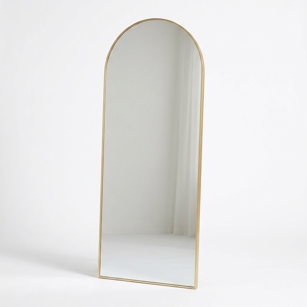 Gold arched floor mirror studio photo on white background
