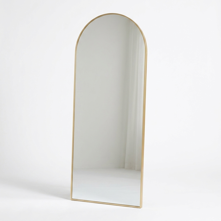 Gold arched floor mirror studio photo on white background