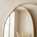 Close-up of the slim gold aluminum frame and glass edge