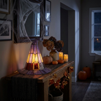 Witch hat lamp as spooky-cozy accent lighting in an entryway at night