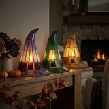 Purple, green and amber witch hat lamps side by side