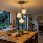 Fluted glass 3-head cluster pendant over a warm wood kitchen island