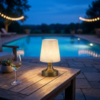 Cordless alabaster lamp glowing on an outdoor patio table at dusk