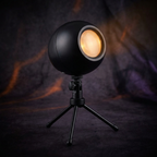 Black dome holiday projector on adjustable tripod stand