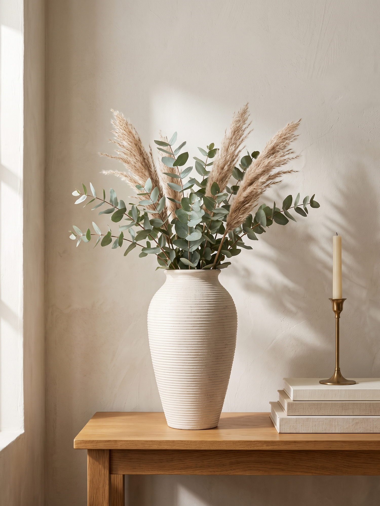Willa ribbed ceramic vase with eucalyptus on an oak console — lifestyle