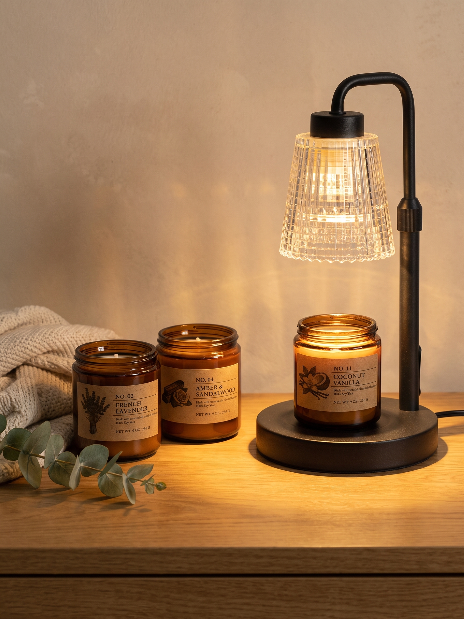 Hearth amber candles with the Ember warmer glowing — lifestyle