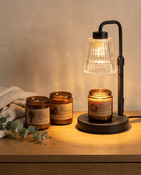 Hearth amber candles with the Ember warmer glowing — lifestyle