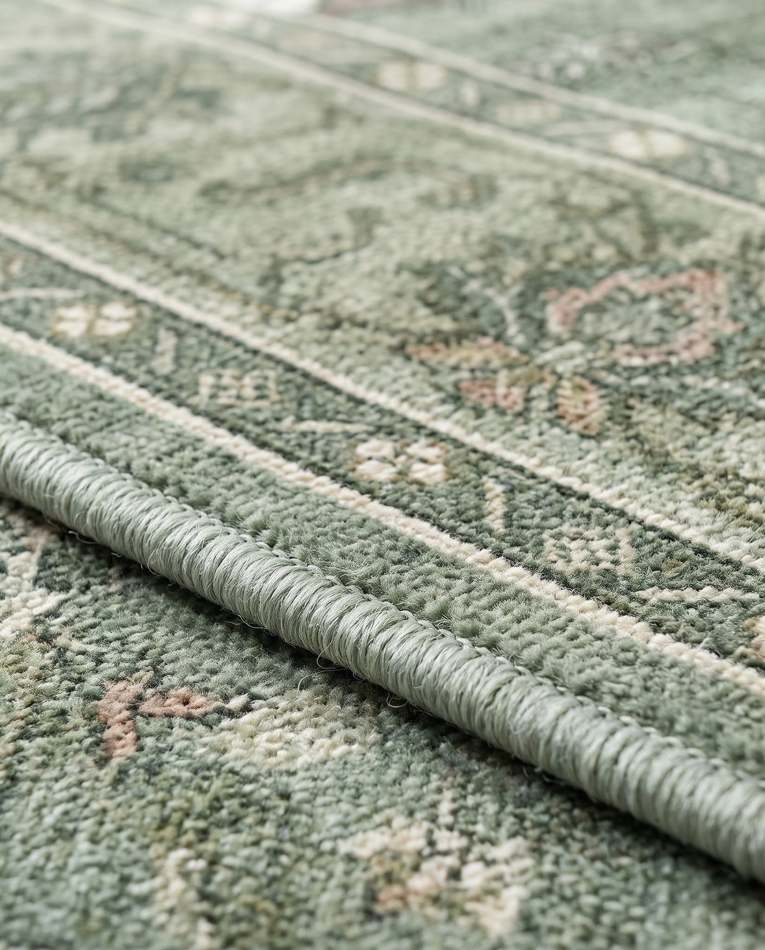 Juniper rug serged edge detail, close-up on white