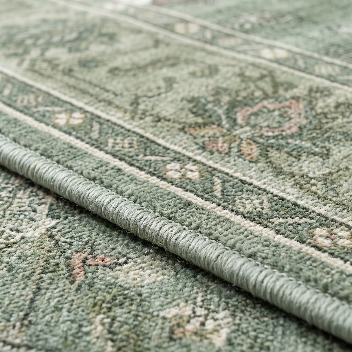 Juniper rug serged edge detail, close-up on white