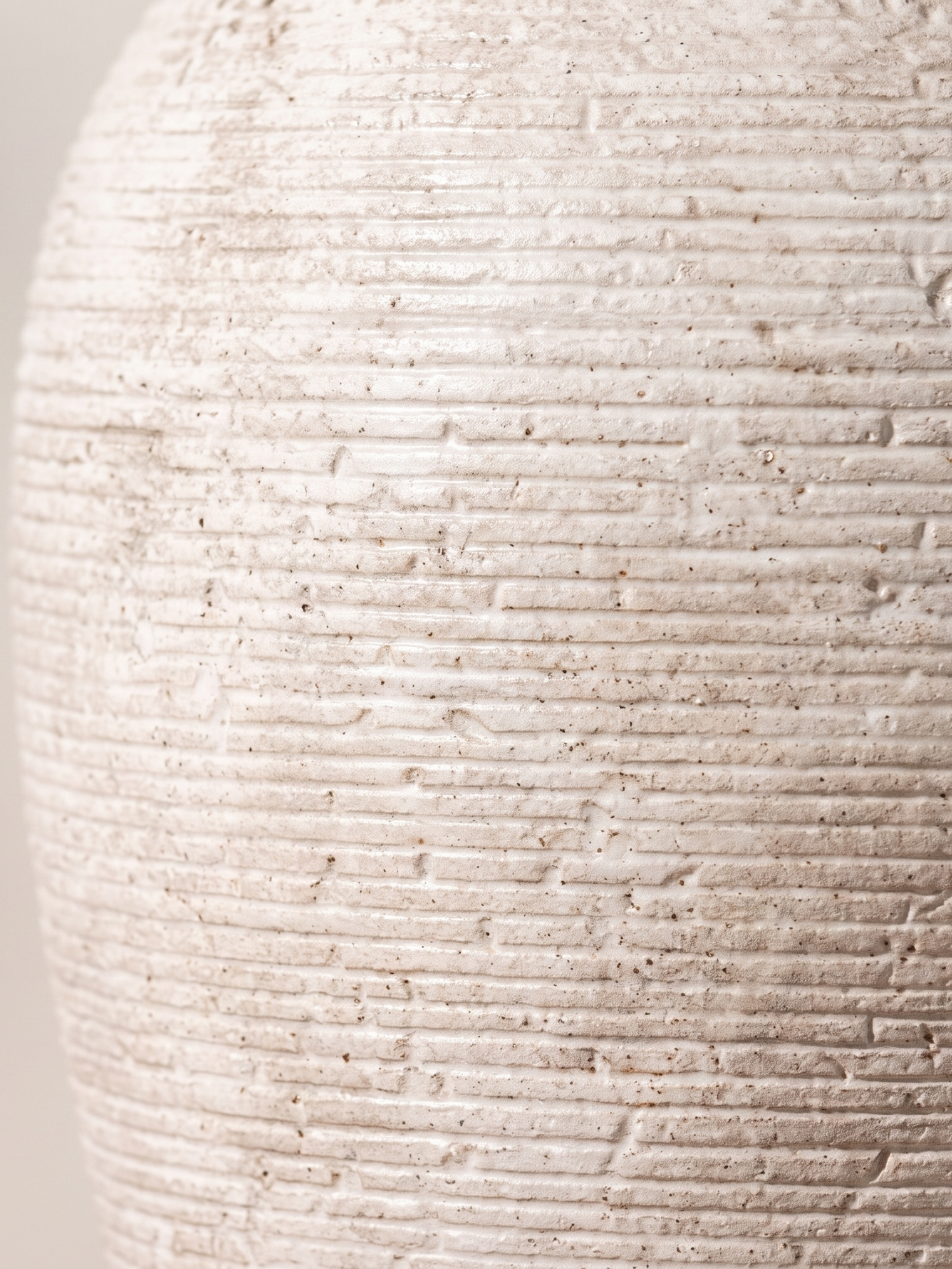 Willa vase ribbed ceramic texture, close-up on white