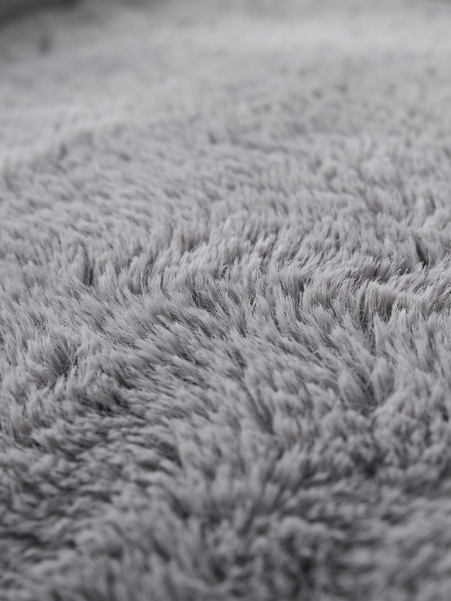Cove dog bed plush faux-fur surface, close-up on white