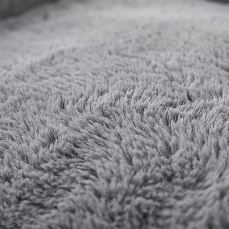 Cove dog bed plush faux-fur surface, close-up on white