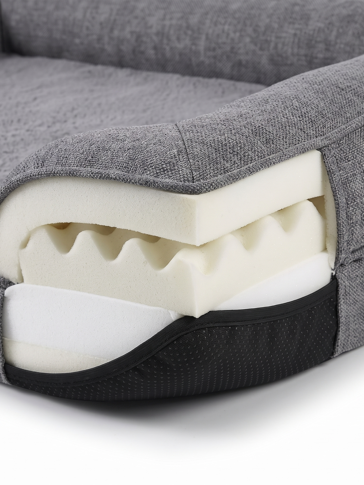 Cove dog bed memory foam layers and non-slip base, close-up on white