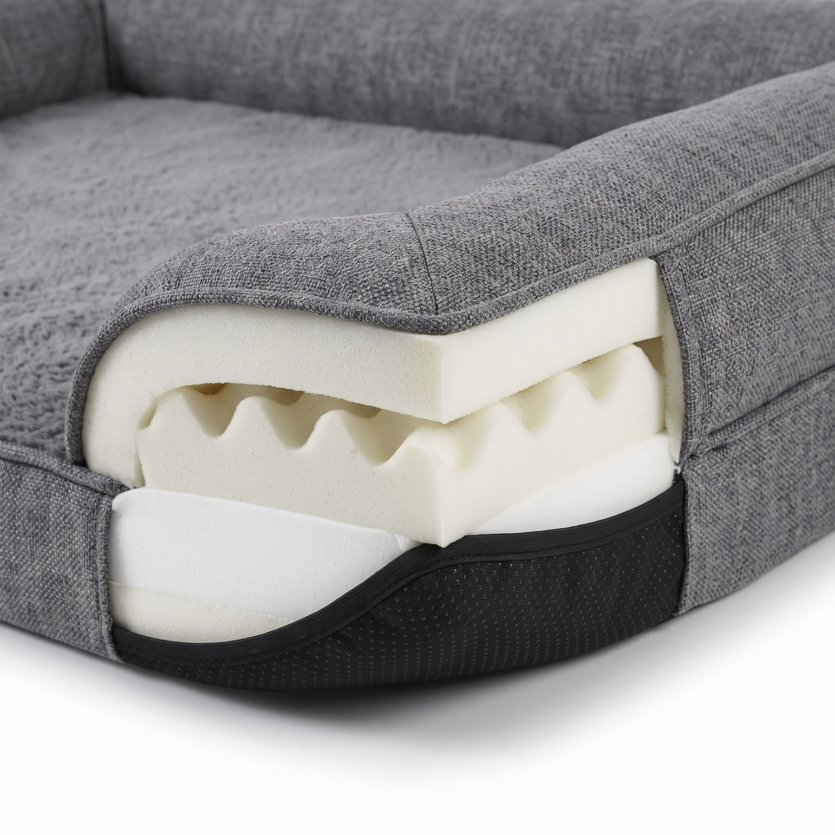Cove dog bed memory foam layers and non-slip base, close-up on white