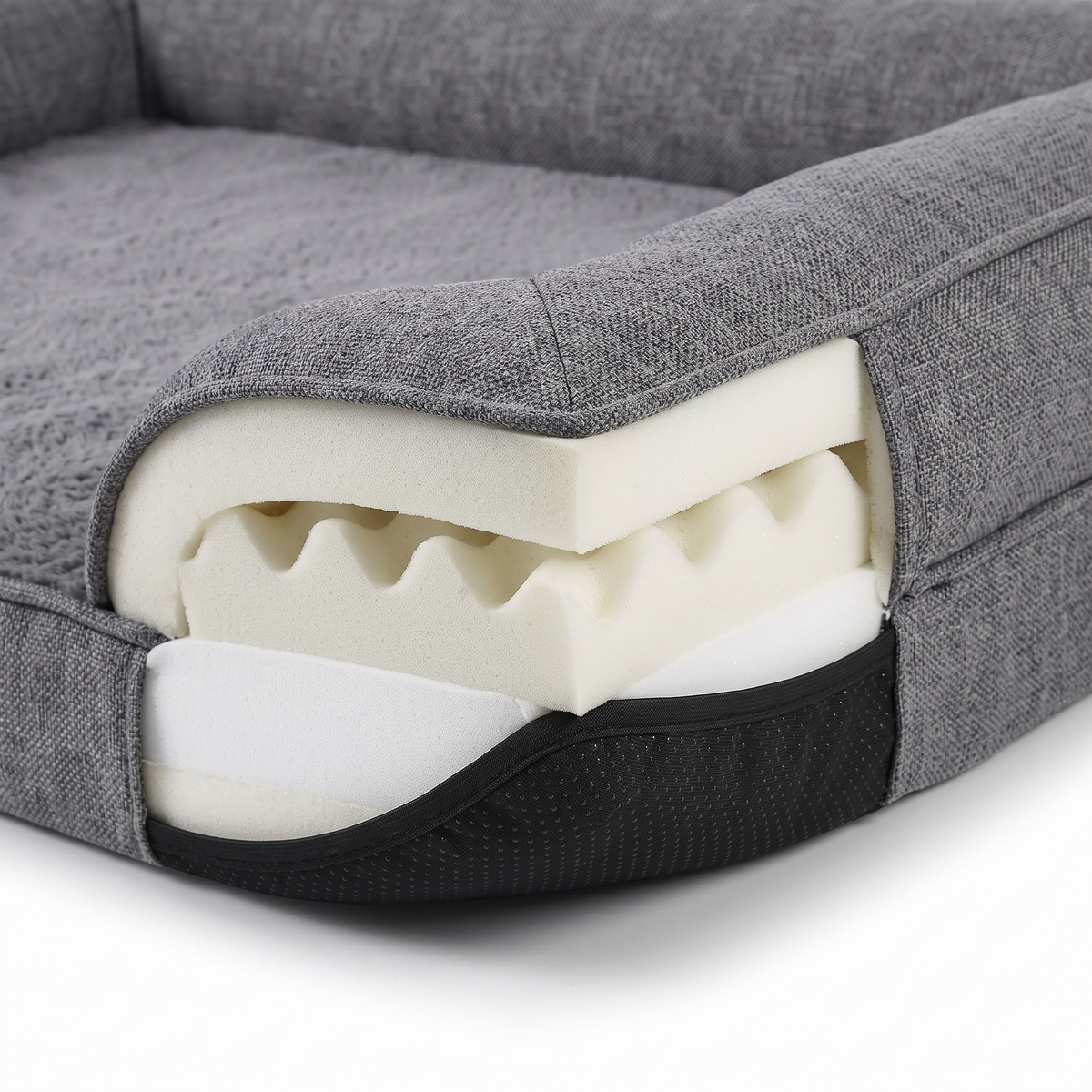 Cove dog bed memory foam layers and non-slip base, close-up on white