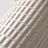 Della lamp grid-textured ceramic base, close-up on white