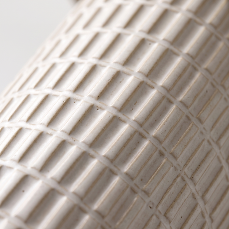 Della lamp grid-textured ceramic base, close-up on white