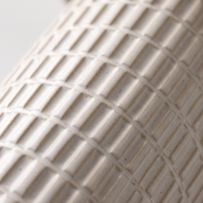 Della lamp grid-textured ceramic base, close-up on white