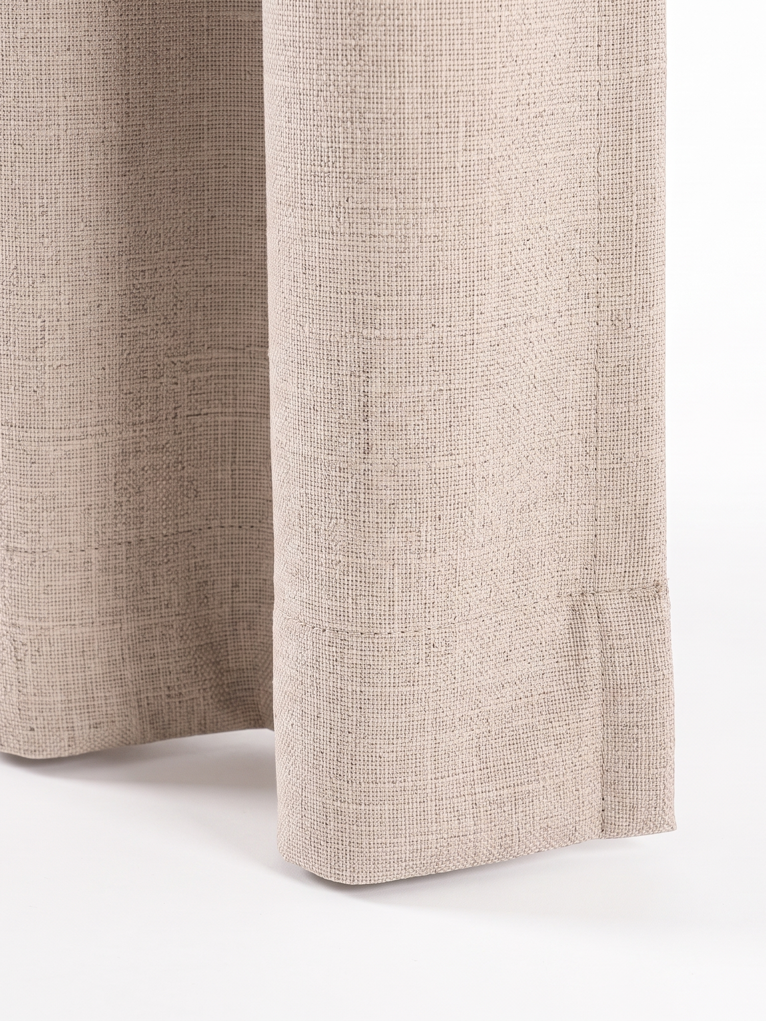Linden curtain bottom hem, close-up on white
