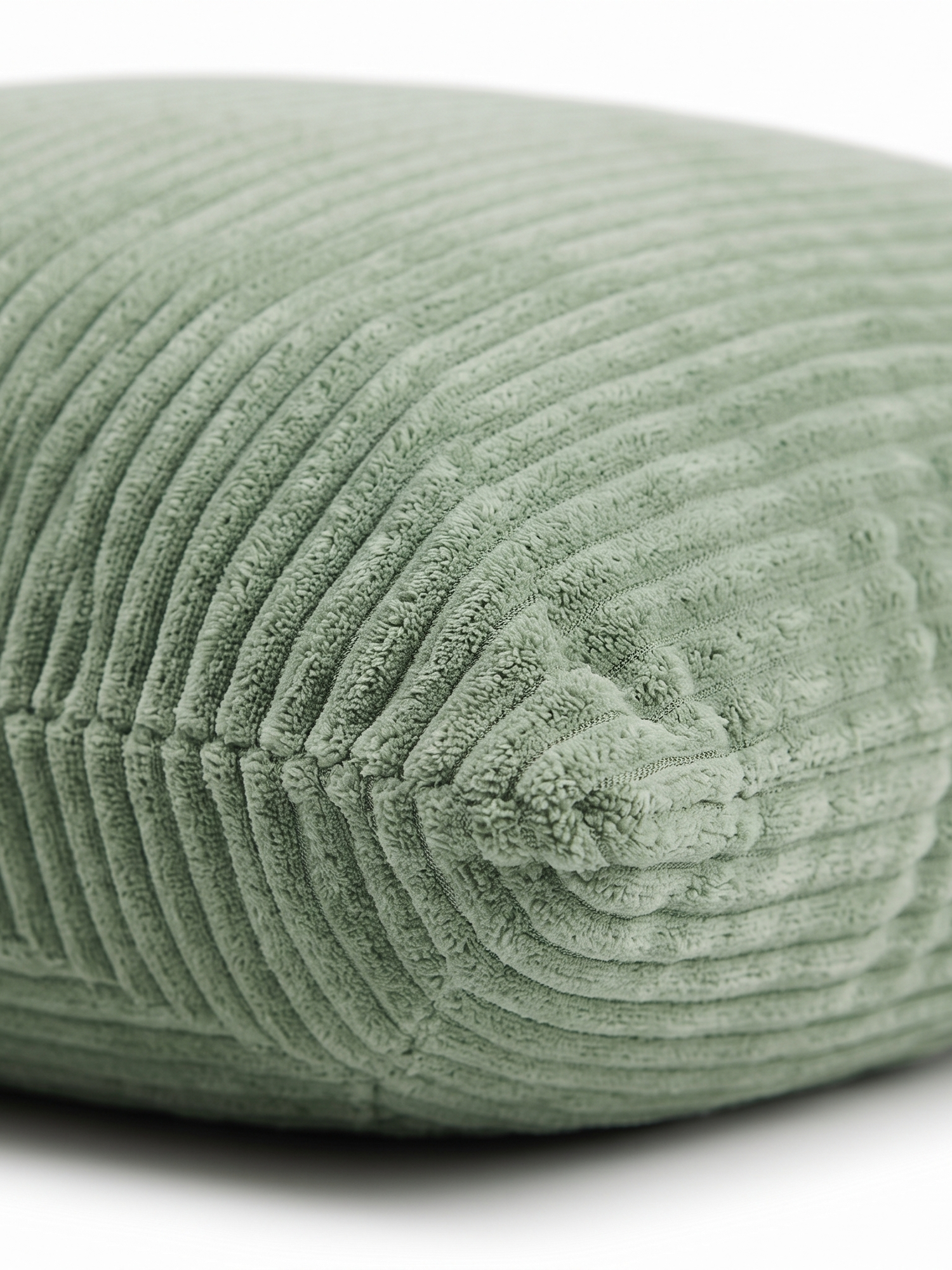 Sorrel pillow cover corner seam, close-up on white