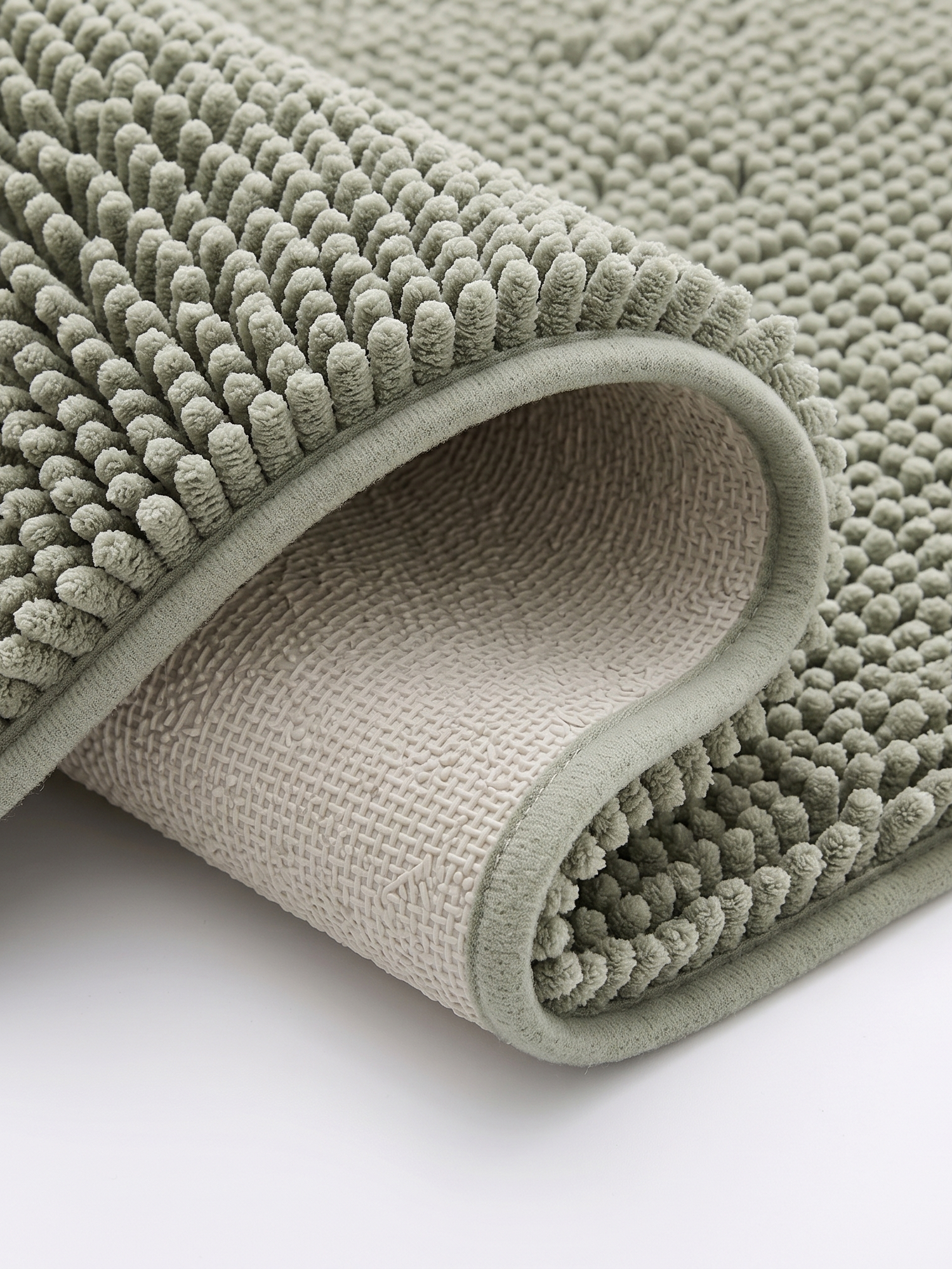 Pebble bath mat non-slip backing, close-up on white