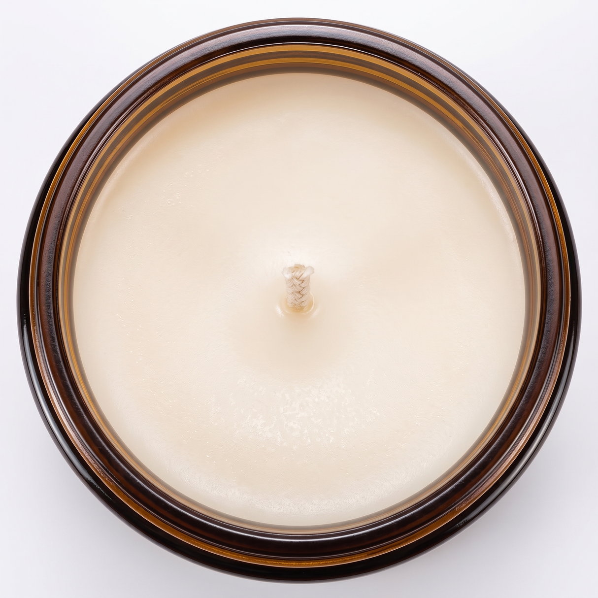 Hearth candle soy wax surface and wick, close-up on white
