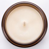 Hearth candle soy wax surface and wick, close-up on white