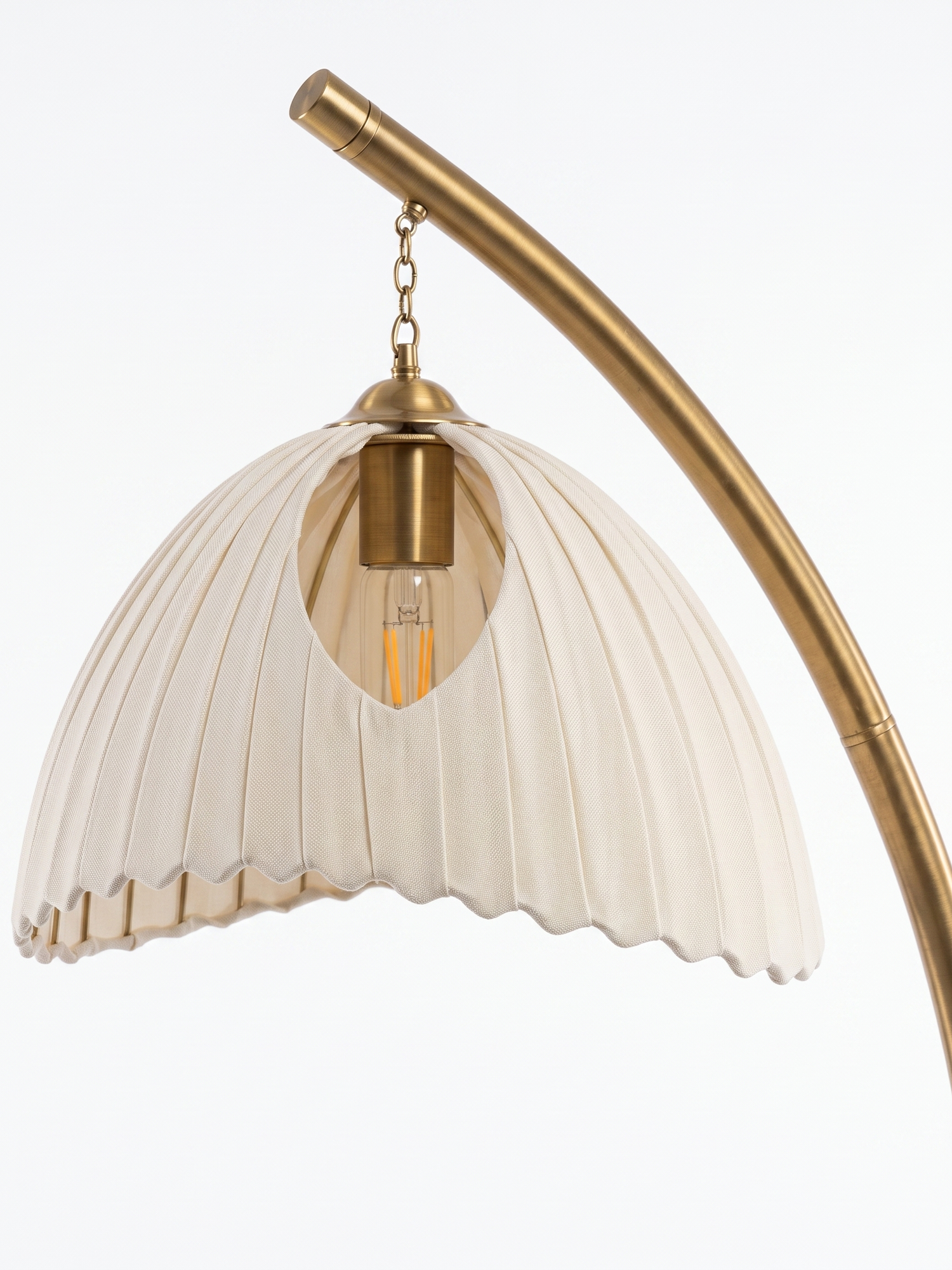 Arcadia brass arc and shade fitting, close-up on white