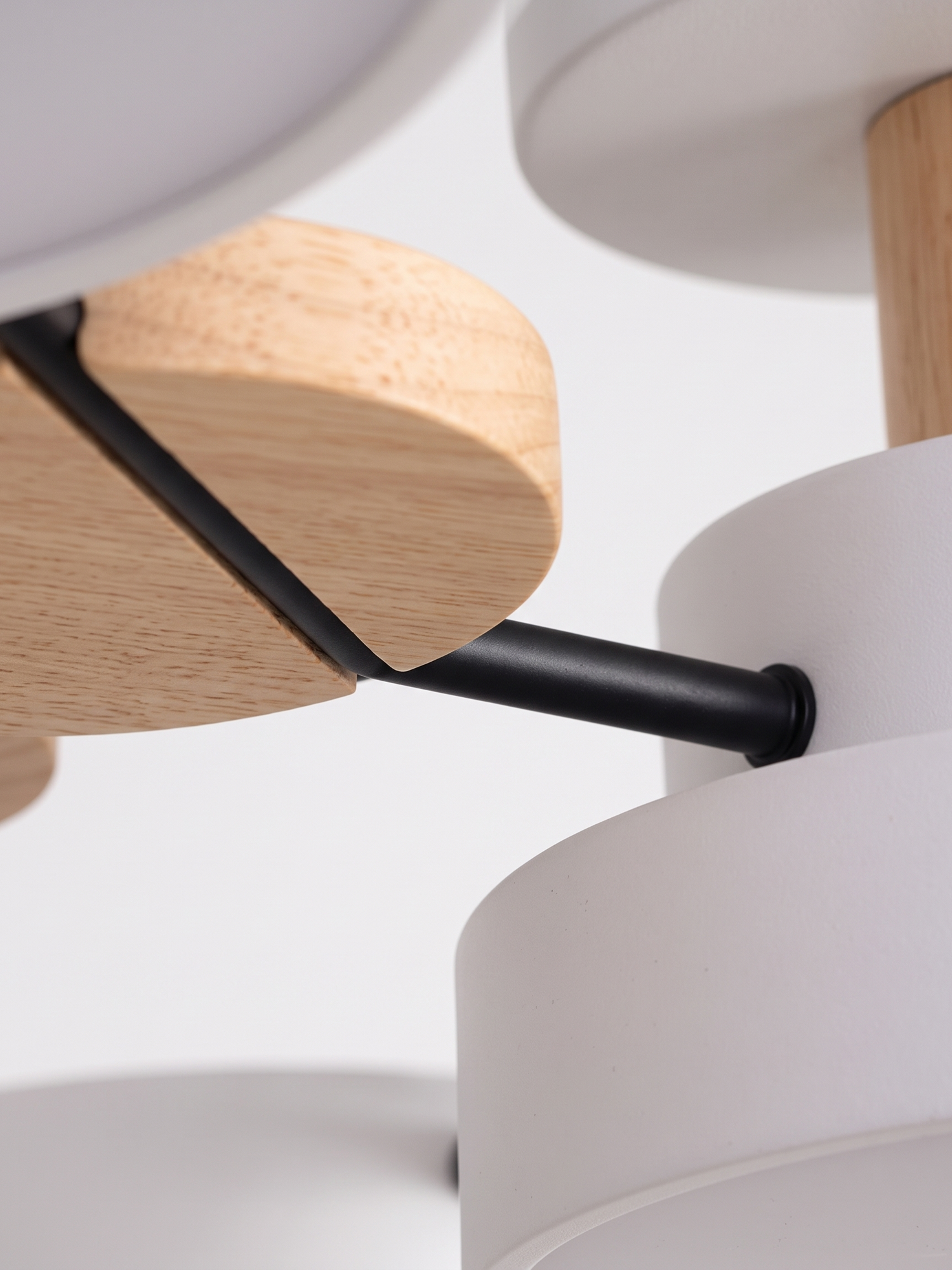 Circa wood accent and black arm joint, close-up on white