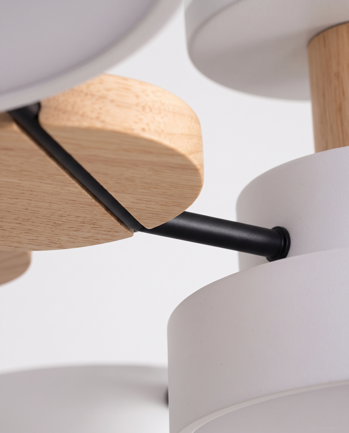 Circa wood accent and black arm joint, close-up on white