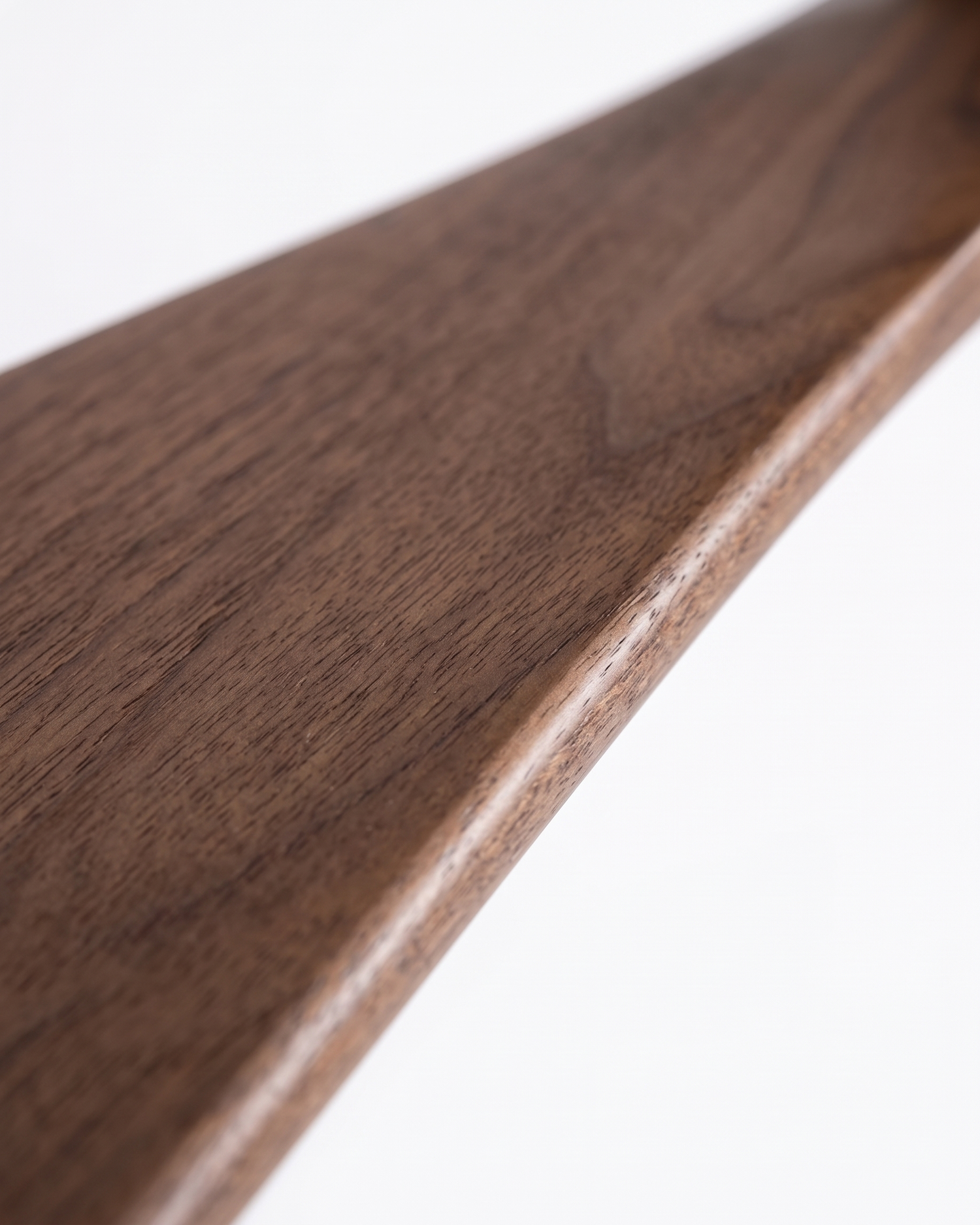Walnut fan blade wood grain, close-up on white