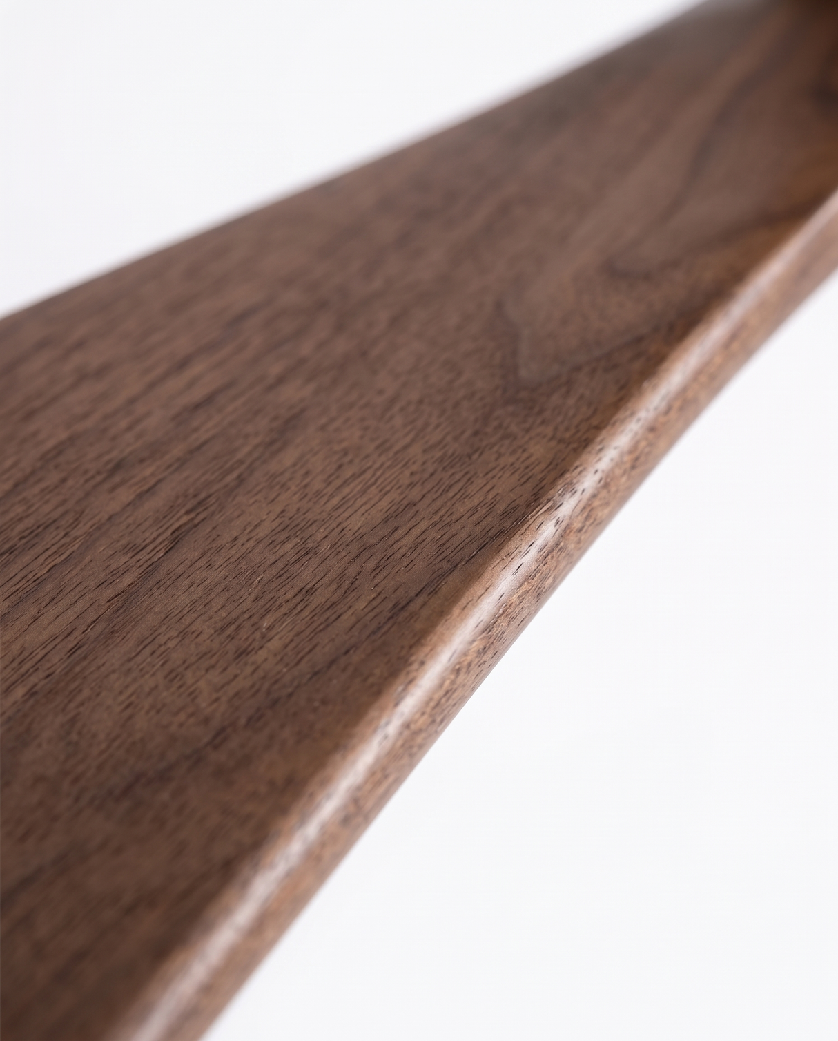 Walnut fan blade wood grain, close-up on white