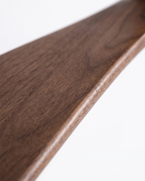 Walnut fan blade wood grain, close-up on white