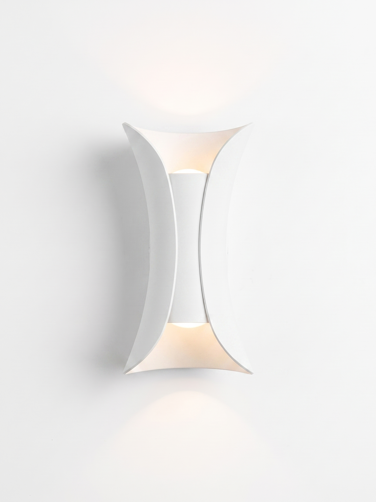 Curved up/down wall sconce, pure white finish, studio on white