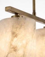 Alabaster shade glowing with natural veining, close-up on white