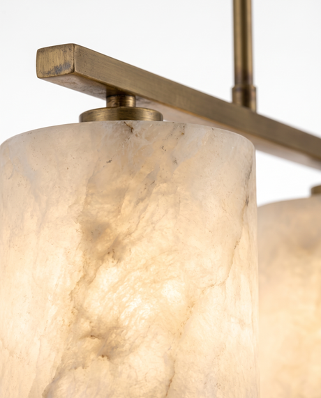 Alabaster shade glowing with natural veining, close-up on white