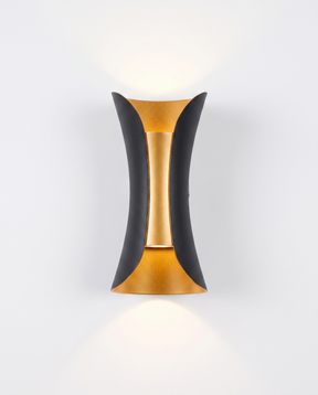Marlow curved up/down wall sconce, black with gold reflector, studio on white