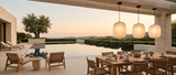 Runa pendants over a travertine poolside dining terrace at dusk — lifestyle