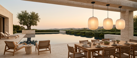 Runa pendants over a travertine poolside dining terrace at dusk — lifestyle
