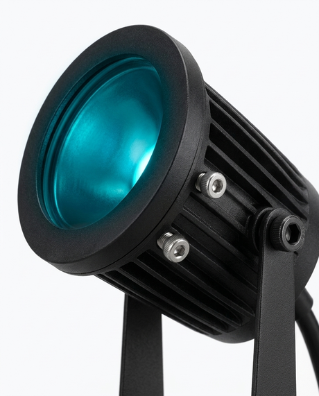 Delia RGB spotlight head glowing teal — studio white