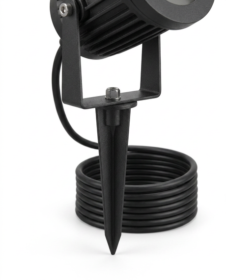 Delia spotlight ground spike and weatherproof cable detail — studio white